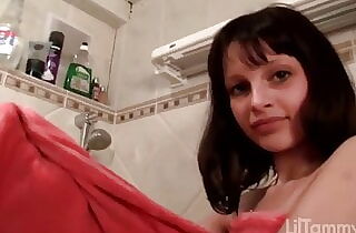 Diminutive nubile touches herself in the shower
