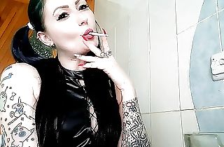 Dominatrix Nika smokes.  Smoking fetish.  Ciggy smoke from the mouth of a charming Mistress right on your face.
