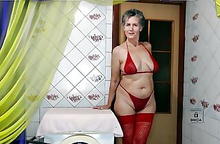 Hot housewife Lukerya again in red lingerie gives a smile and cheers up her fans by talking with flirting online on a w